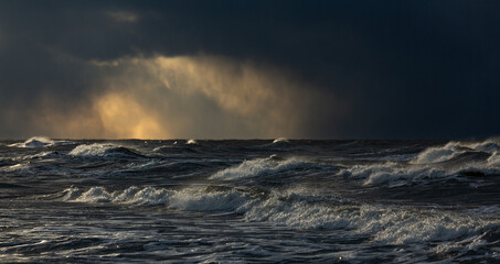 Wonderfully beautiful sunset by the sea in winter with ice
