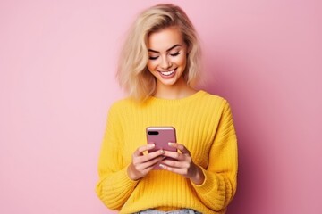 Fototapeta premium Young blonde woman sweater yellow smile.