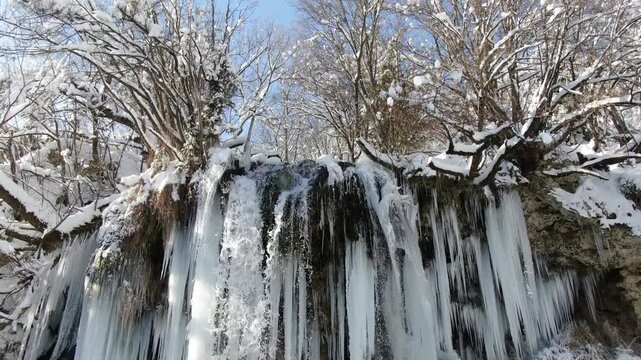 Unreal Winter Time of Frozen Waterfall Gostilje. Drone Shot