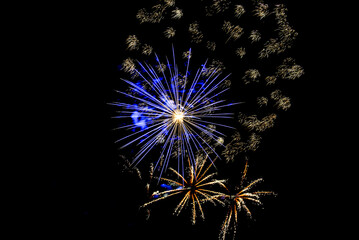 Fototapeta premium Fireworks lighting up the night sky. Pyrotechnics, abstract 