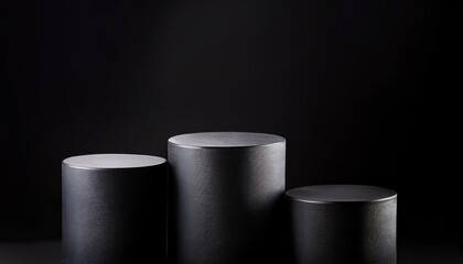 four balck podiums with different heights pedestals for product presentation pure black background