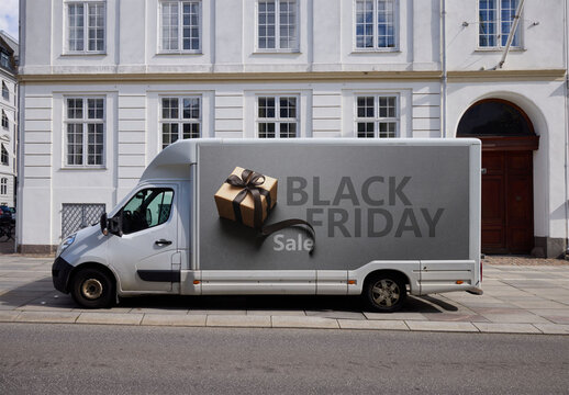 Side view of customizable Delivery Van Parked Along a Street in Copenhagen. Space for branding. Insert your logo PSD mockup