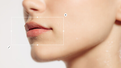Close-up of young girl lips with hydrated look, emphasizing natural beauty and lip care. Cropped...