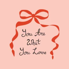 Girl quote with red coquette bow, ribbon on the pink background. Hand written phrase. Vector lettering element. Female positive sayings. The inscription - You are what you love. Cute greeting card.