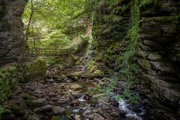 Walking in the forest to the golspie burn waterfall and hiking along the beautiful gorge, near Brora in Scotland