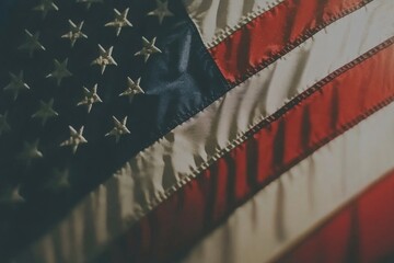 Fototapeta premium Waving American flag against a clear blue sky symbolizing national pride and unity