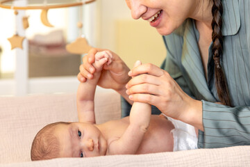 A young mother with a newborn baby. Newborn baby.