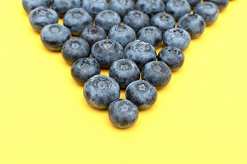 Fresh blueberry on yellow background	