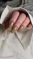 The beauty of the natural nails. Perfect clean manicure. New trendy nail arts on young women hand. Beautiful nail polish in hand