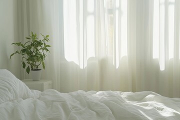 Sunlight illuminating white bedroom with unmade bed and houseplant