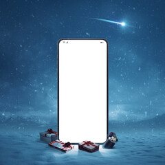 Big smartphone in a wintry landscape and gifts