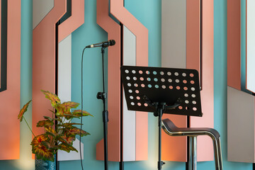 A modern music studio setup with a keyboard, microphone, and music stand, ready for recording or...