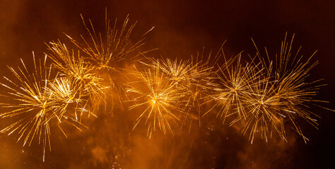 A firework display illuminating the night sky © lemanieh