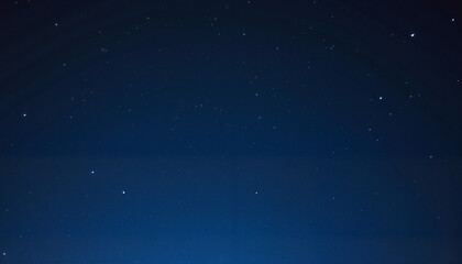 Obraz premium Starry night sky with scattered stars creating a cosmic atmosphere, wallpaper , background