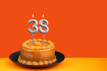 Birthday candle number 38 - Cake with dulce de leche frosting.