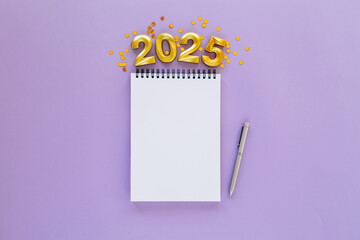 2025 New Year concept with empty notebook for your goals, plans, resolutions. Flat lay style....
