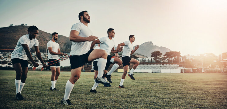 Sports, rugby and men on field for training, exercise and workout for game or match in morning. Teamwork, collaboration and athletes with practice equipment for challenge, performance and fitness - Powered by Adobe