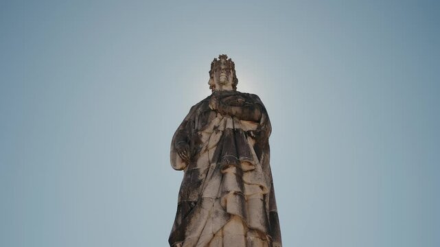 Statue of King D. Dinis at Parque de Santa Cruz, Coimbra, Portugal, against clear sky