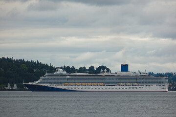 Modern family cruiseship cruise ship liner Luminosa sail away departure from Seattle, Washington...
