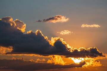 Fototapeta premium Glistening Golden Sunrise Clouds for Uplifting Motivational Posters