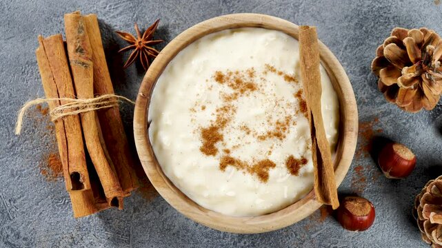 Delicious rice pudding with cinnamon in bowl