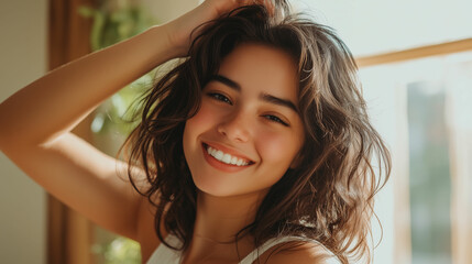 Fototapeta premium Young woman smiling joyfully in a sunlit room with natural decor during the afternoon