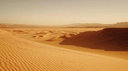 A desert landscape with sand dunes under a clear sky