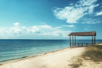 Fototapeta premium A tranquil scene with a deserted beach hut by the smooth, shimmering waters of the ocean.