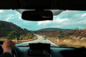 view from the windshield of the car on the road.through the mountains