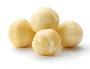 Raw macadamia nuts with smooth, pale cream shells grouped together, isolated on a pure white background