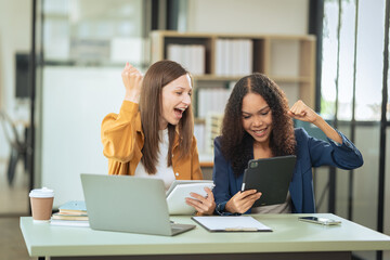 Two businesswomen rejoice in success in business Smile and express happiness success in starting teamwork concept