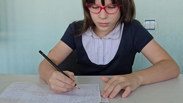 Student using formula math sheet to cheat on test. Hand of university student holding pencil doing math question in examination and cheating in test with answer 