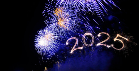 Sparkler 2025. Firework illumination on dark sky background, happy new year 2025 concept. Sparkler 2025 text colorful firework. Happy New Year 2025 firework overlay background. Sparks, fireworks
