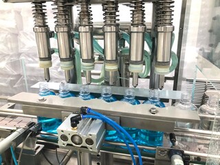 A liquid filling machine equipped with six nozzles for efficient bottle filling. The automated system is designed for precise liquid dispensing, enhancing productivity and consistency in pharma plant
