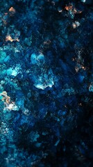 Obraz premium Abstract cosmic texture with deep blue hues and glowing specks reminiscent of a nebula or underwater scene, evoking mystery and wonder in a macro view.