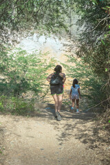 Walking in the forest, Landscape photographs of foliage or forest and mother and daughter walking through it.