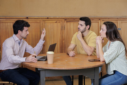 Boss meets with employees, handshake in agreement for greeting. Teacher meets with parents and shakes their hands in greeting and cordiality.