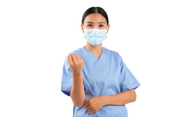 Confident nurse in uniform gestures while wearing a mask, symbolizing care and professionalism in healthcare.