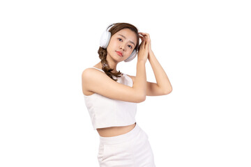 Naklejka premium Young woman enjoying music with headphones on a white background.