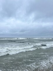stormy cloudy seascape, waves at the sea, rainy clouds