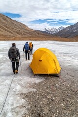 Adventurers trek across ice to set up camp in stunning mountain landscape