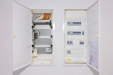 Open electrical panel with fuses, providing essential circuit protection and safety for the electrical system in a home or building.