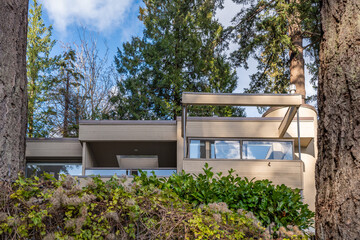 Luxury house with big tree and nice Fall foliage landscape in Vancouver, Canada, North America. Day...