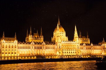 Fototapeta premium Illuminated Hungarian Parliament Building at Night in Budapest, Hungary