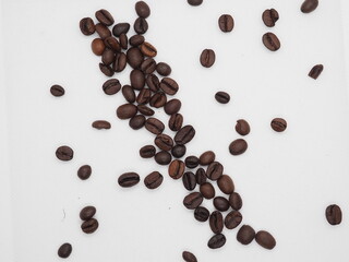 Obraz premium Coffee beans on white background, place for logo