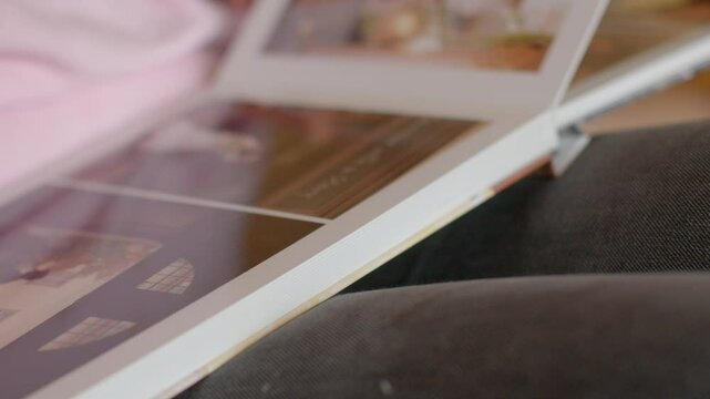 hard pages wedding photo book An incredibly touching moment was beautifully captured as someone gently flips through a cherished family photo album