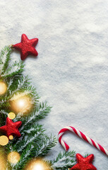 Christmas background with red decorations on white snow background. Top view.