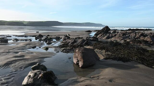 Natural rocks and seaweed left exposed at low tide