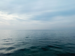 Calm sea under a sunset sky. waterline. sea water surface. mockup. product display. minimalistic....