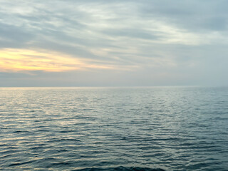 Fototapeta premium Calm sea under a sunset sky. waterline. sea water surface. mockup. product display. minimalistic. abstract background. horizontal